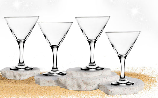 Side profile view of a single stemmed martini glass highlighting the slender stem and wide bowl