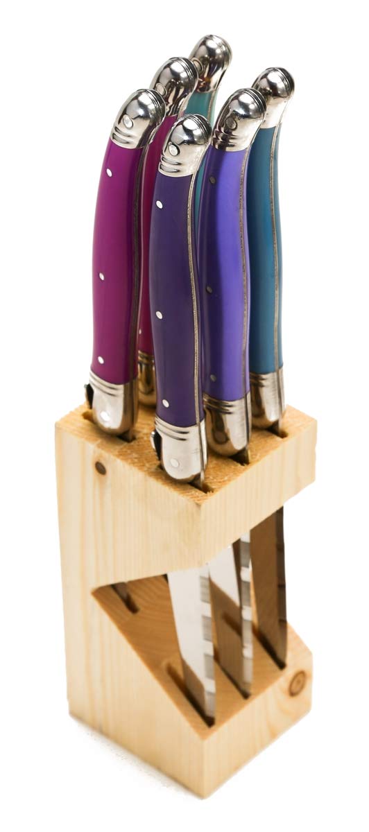 Side view of Laguiole steak knives arranged in wooden block showing full handle detail