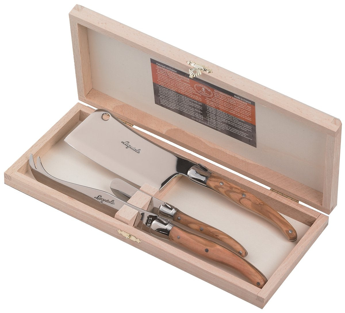 All three Laguiole cheese tools laid flat outside tray on linen table setting