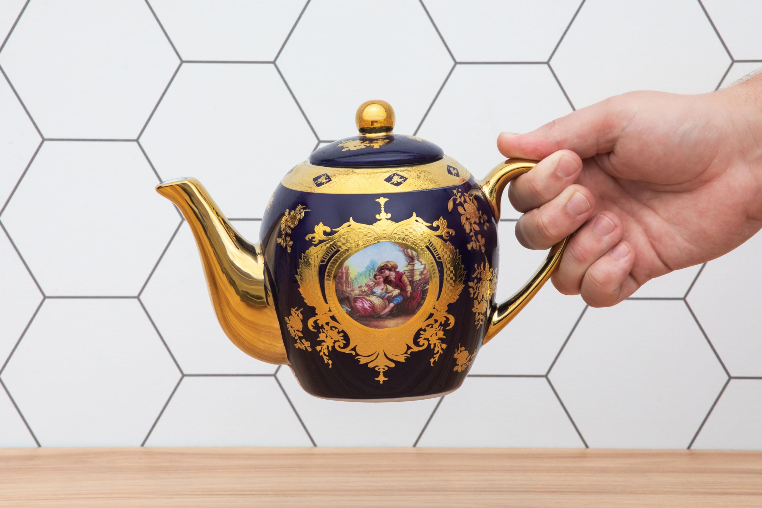 Royalty Porcelain Vintage Teapot presented as a gift, highlighting its elegant cobalt and gold design