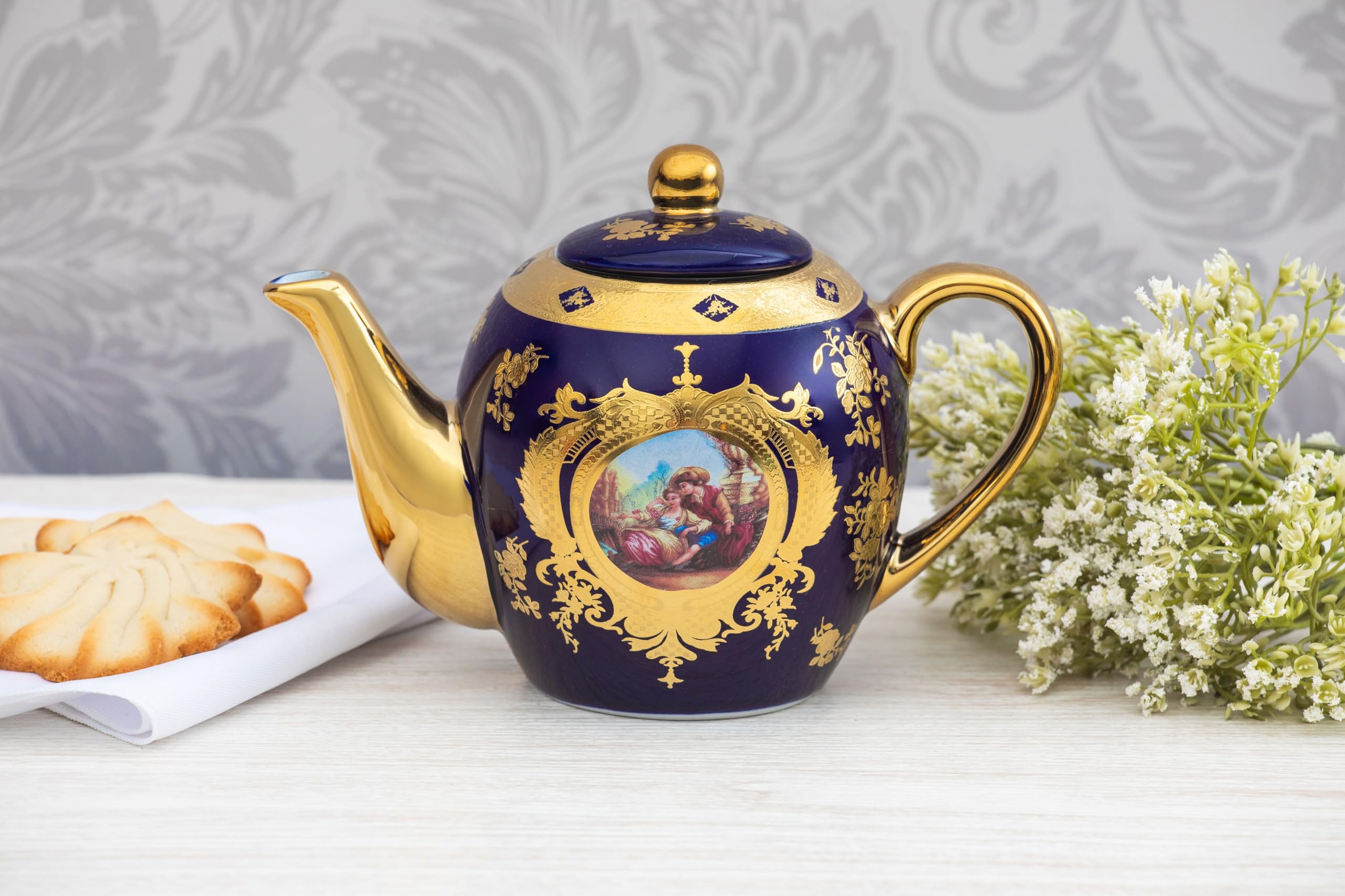 Close-up of hand-painted cobalt blue motif and 24K gold leaf detailing on Royalty Porcelain teapot