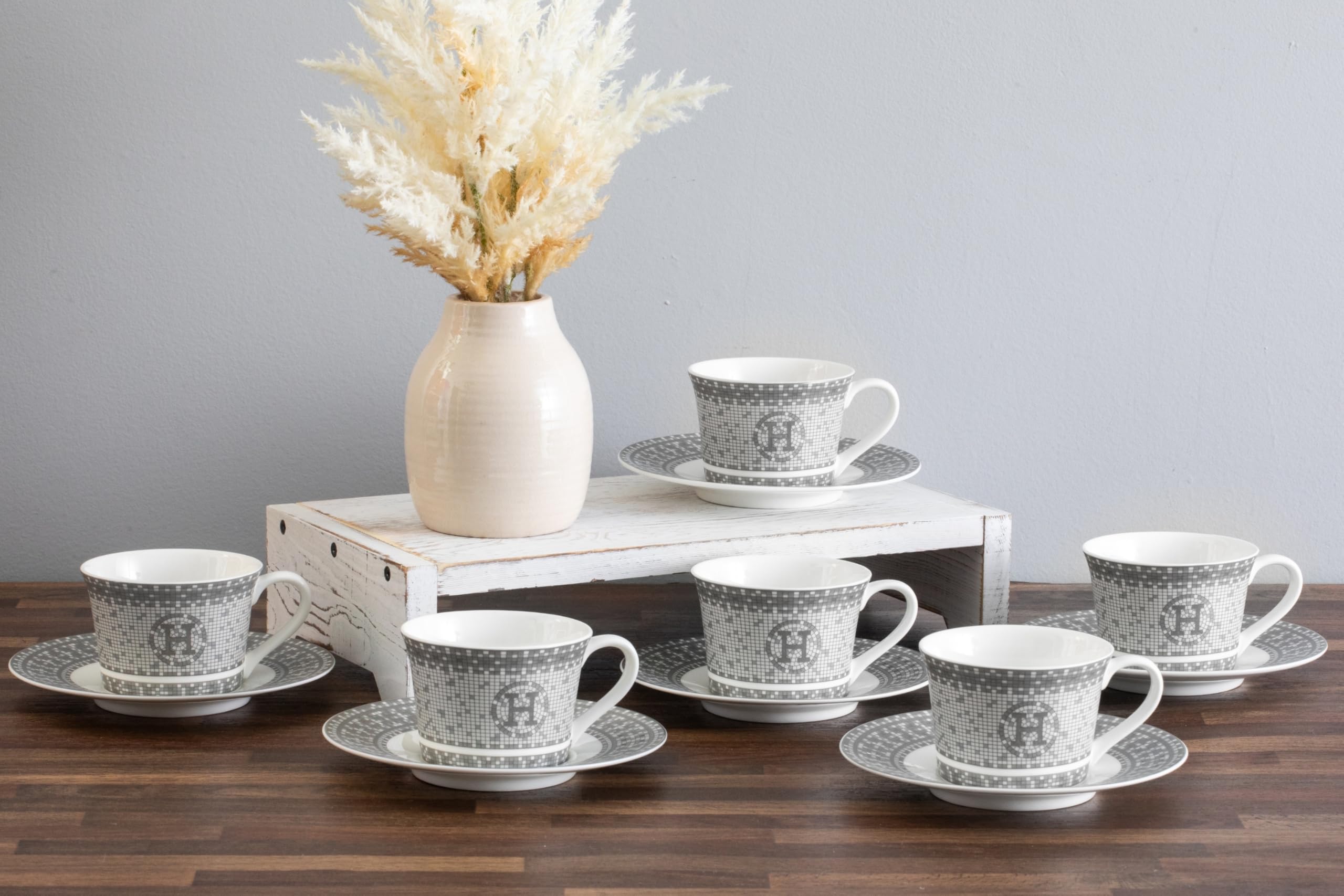 Close-up of hand-painted silver accents and mosaic texture on porcelain tea cup
