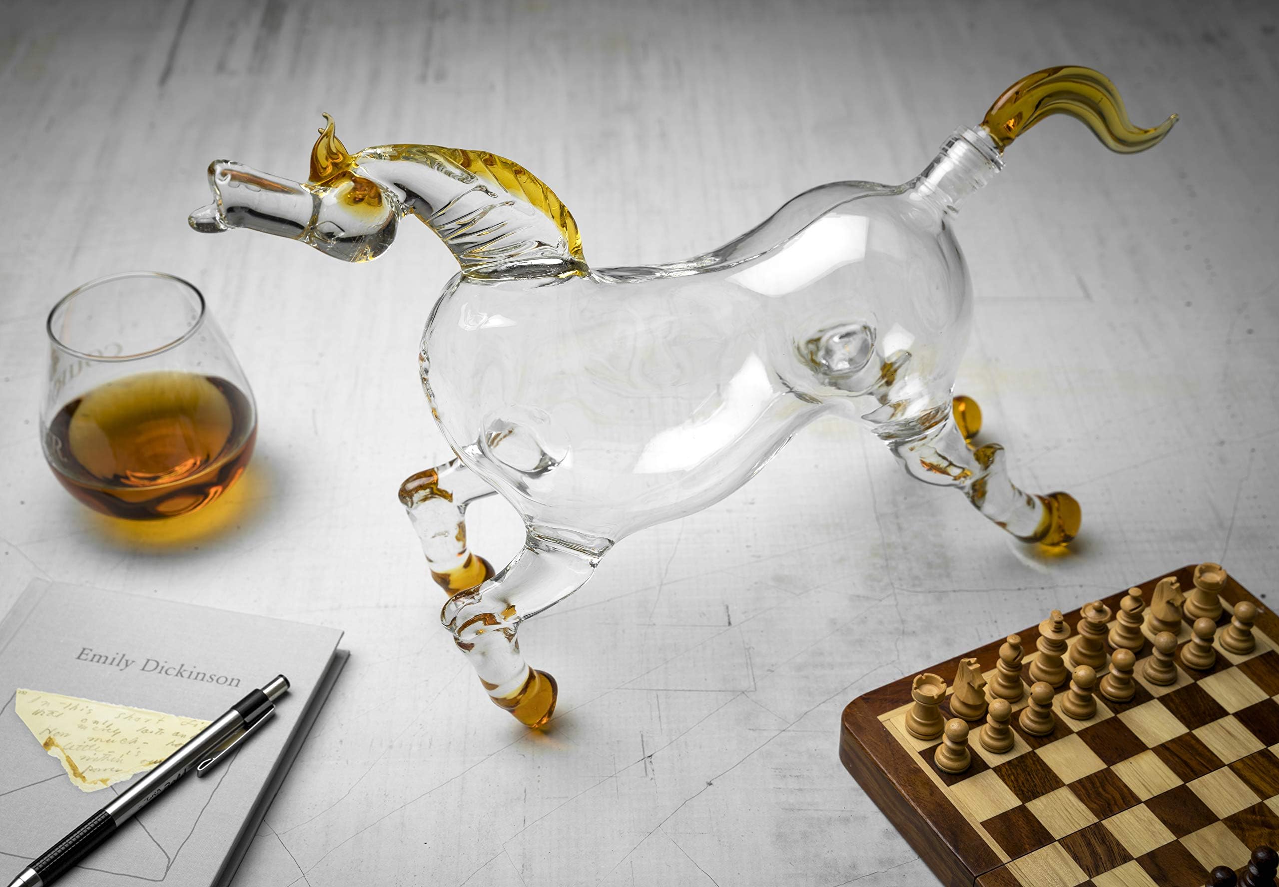 Top-down view of the horse decanter opening and both glasses arranged as a set