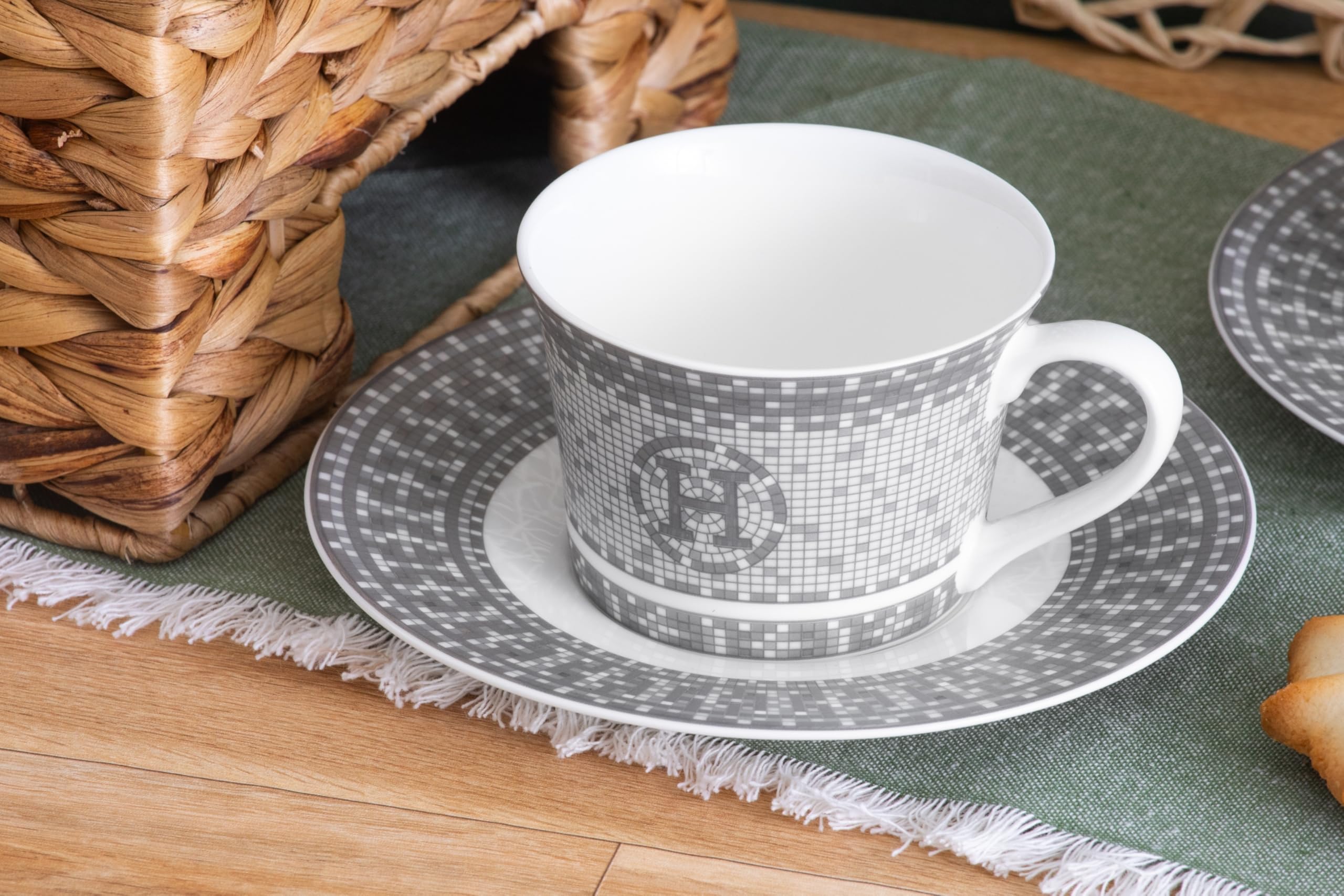 Full set of six porcelain cups and six saucers arranged together showing complete 12-piece tea service
