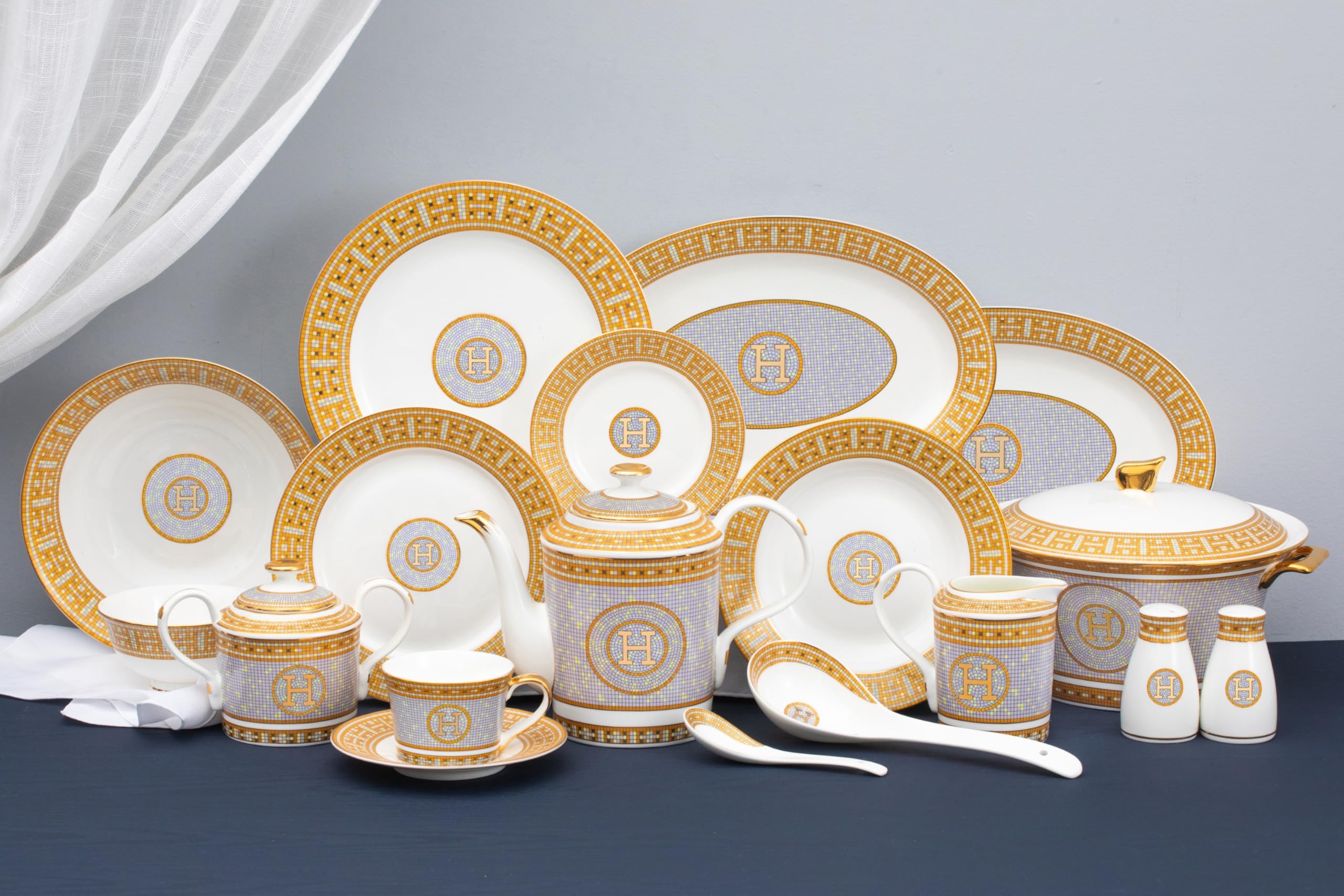 Royalty Porcelain Mosaic 58-piece set arranged on a formal dining table with elegant place settings