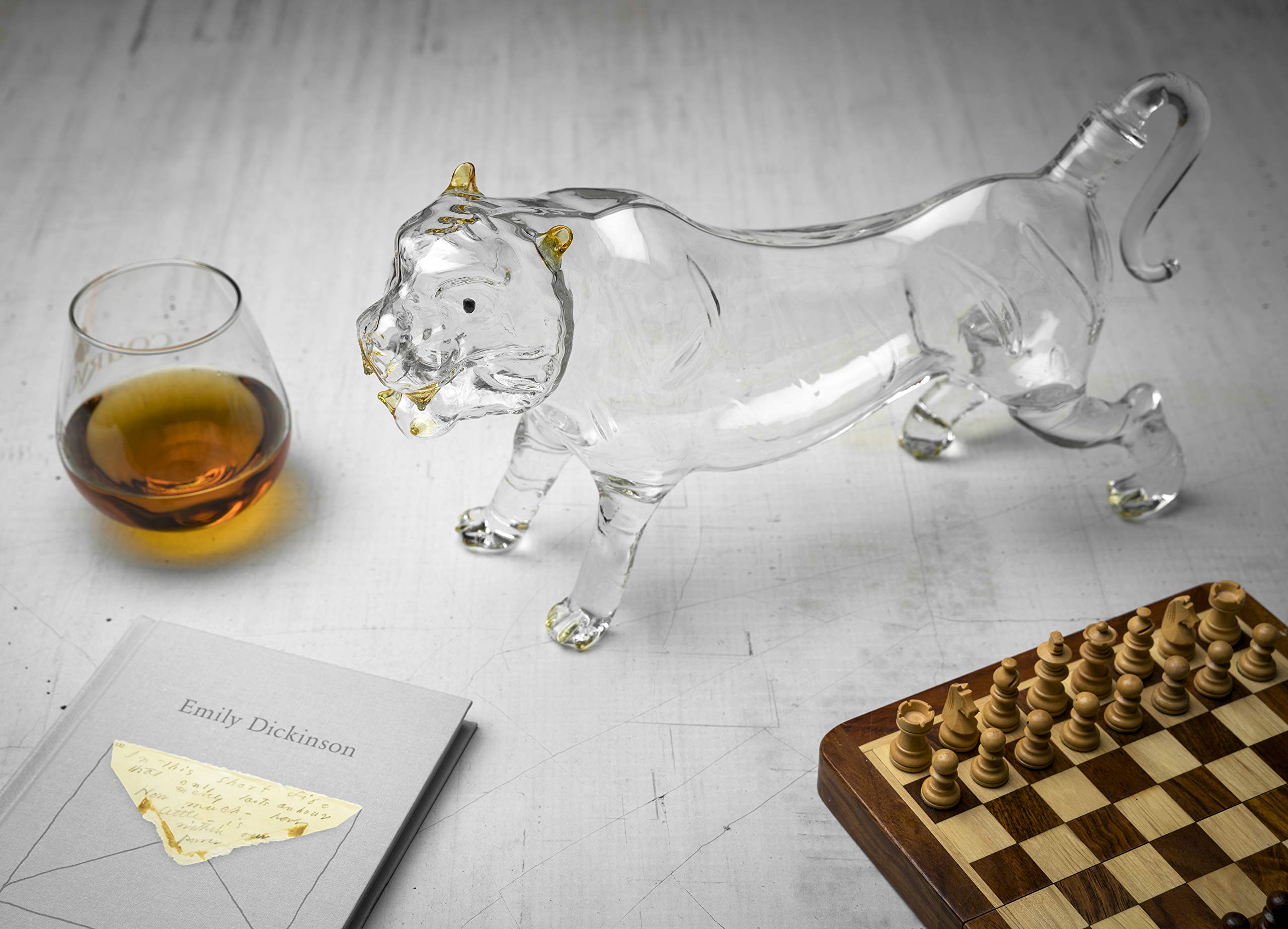 Scale reference shot of the horse decanter beside a standard whiskey bottle