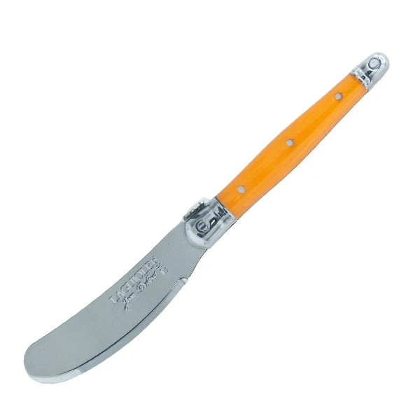 Gifts Plaza spreader knives reflected on a polished tabletop showing mirror-bright finish