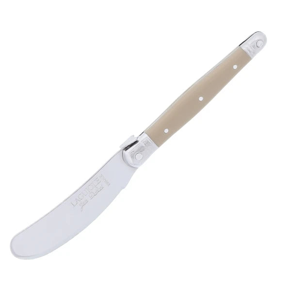 Two Gifts Plaza stainless steel spreader knives crossed to show proportion and symmetry