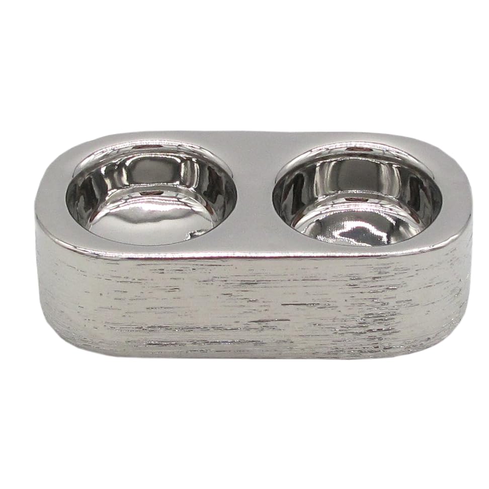 Silver double tealight holder with embossed rounded design displayed on a white surface