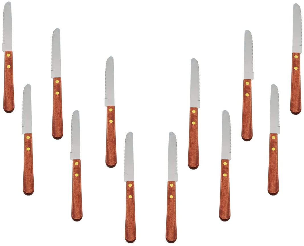 12-piece stainless steel steak knife set with wooden handles displayed in a full flat lay arrangement