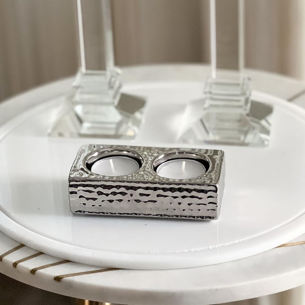 Close-up of the embossed silver finish on the double tealight holder, highlighting decorative texture and craftsmanship detail