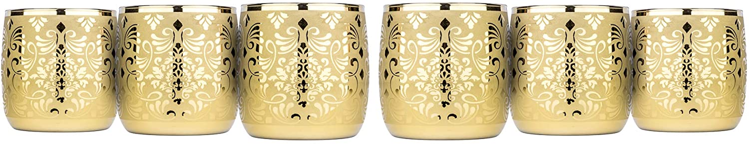 Six Liberty gold rock glasses arranged as a complete set on a white surface